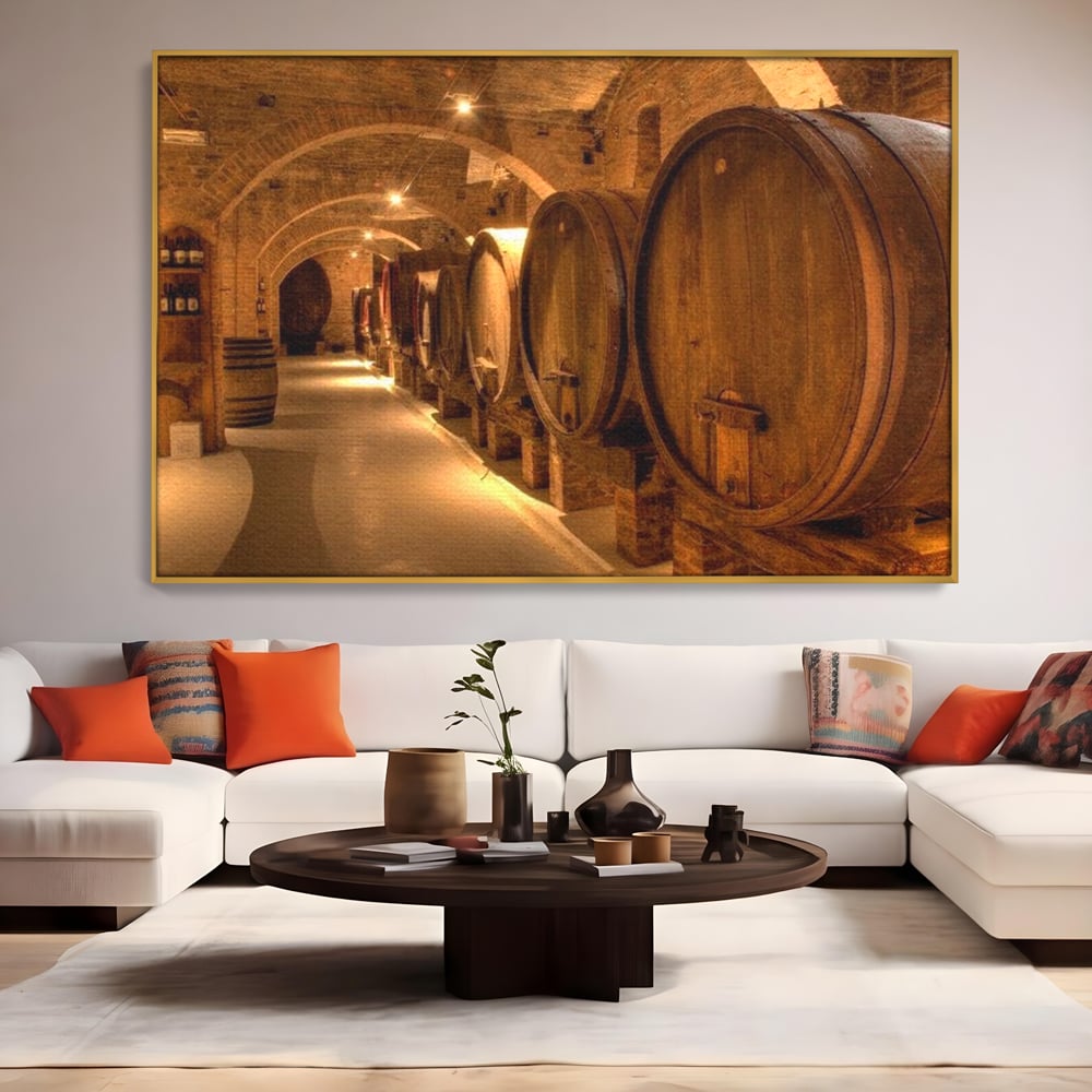 Tablou canvas cu tablou canvas cu butoaie de vin in crama, in rama de aluminiu auriu, pe perete intr-un living